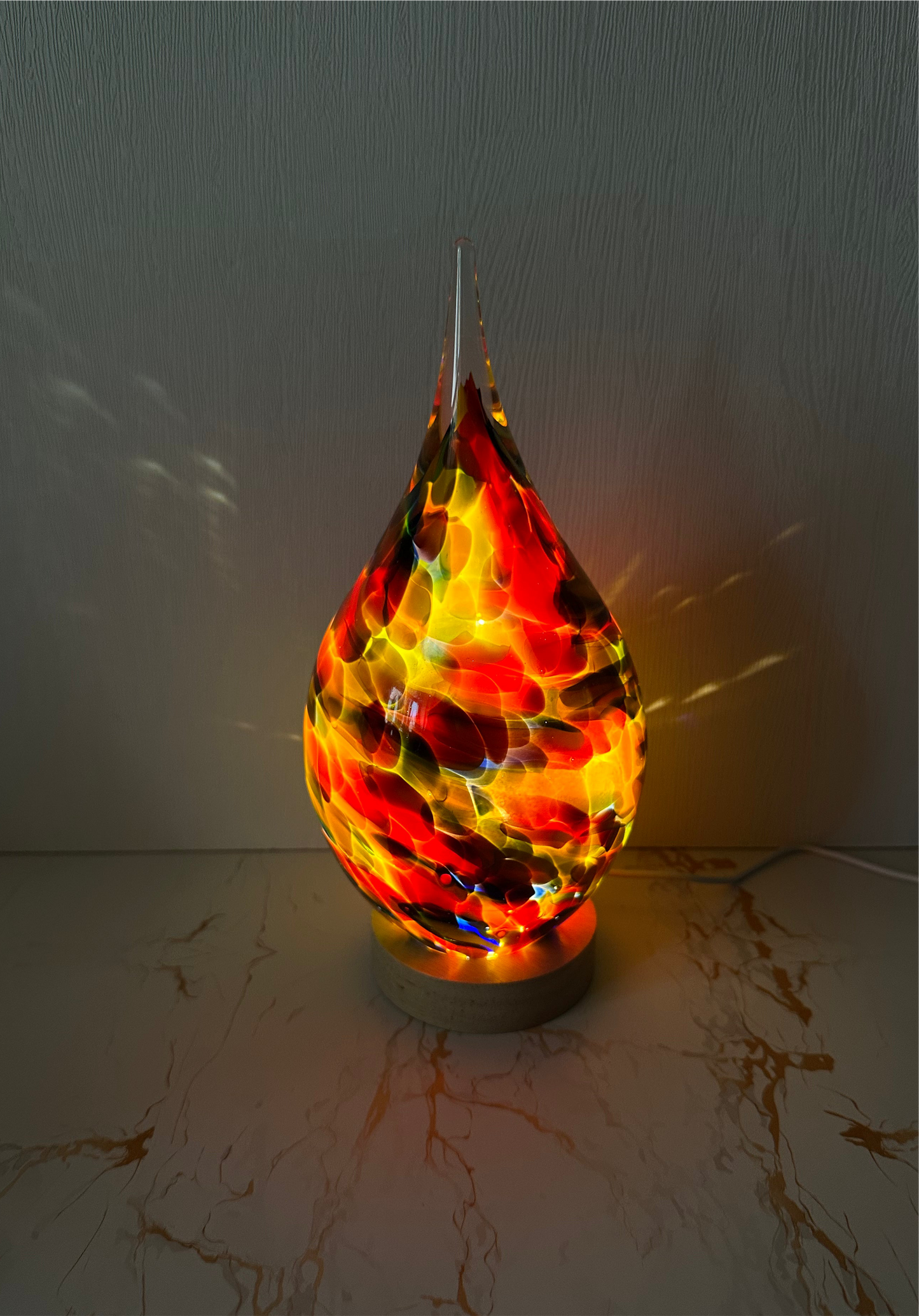Handmade glass USB lamp in a colorful tear drop design a unique piece of art that fills your space with warmth and magical reflections